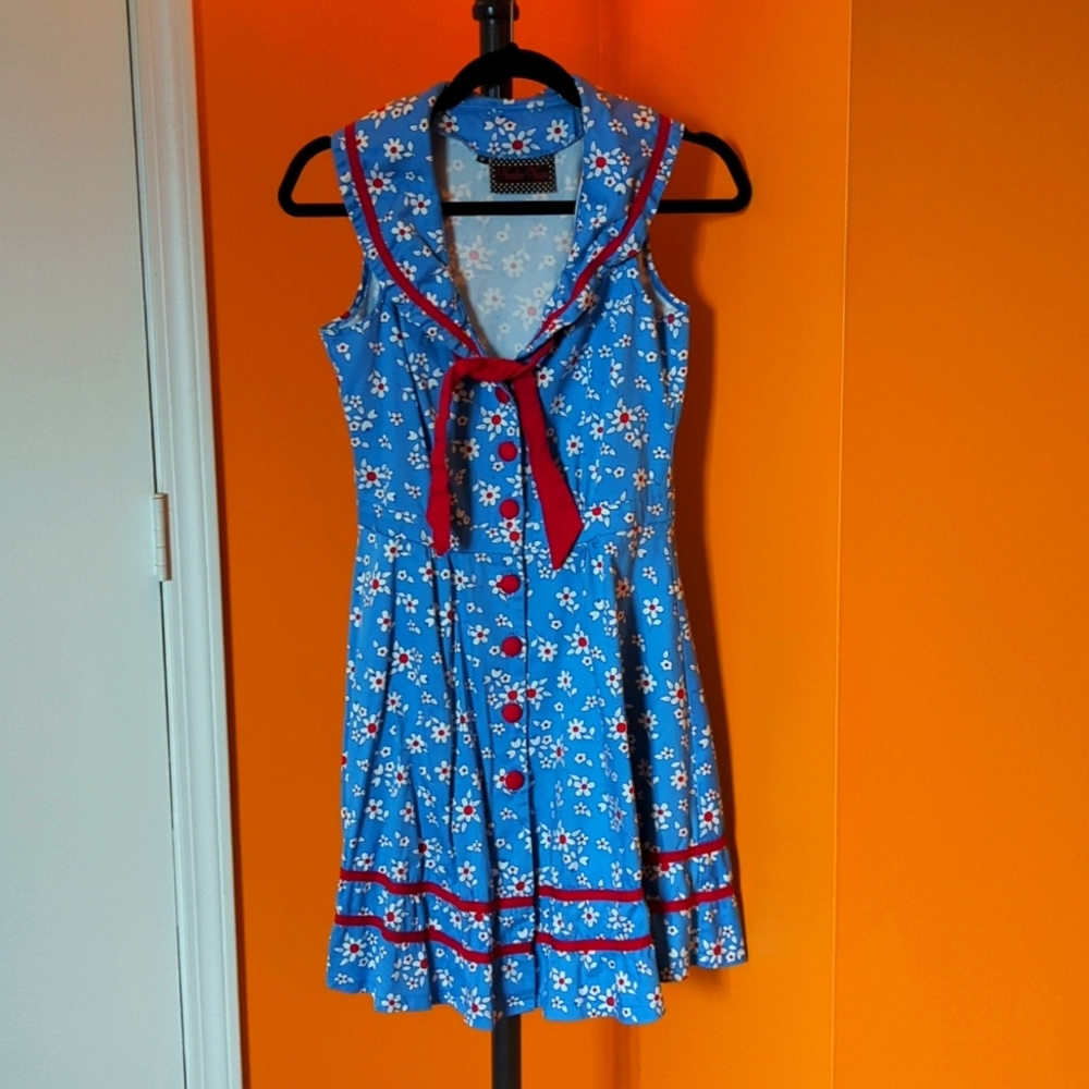 Floral, sailor sleeveless dress. Skater length with bow detail.